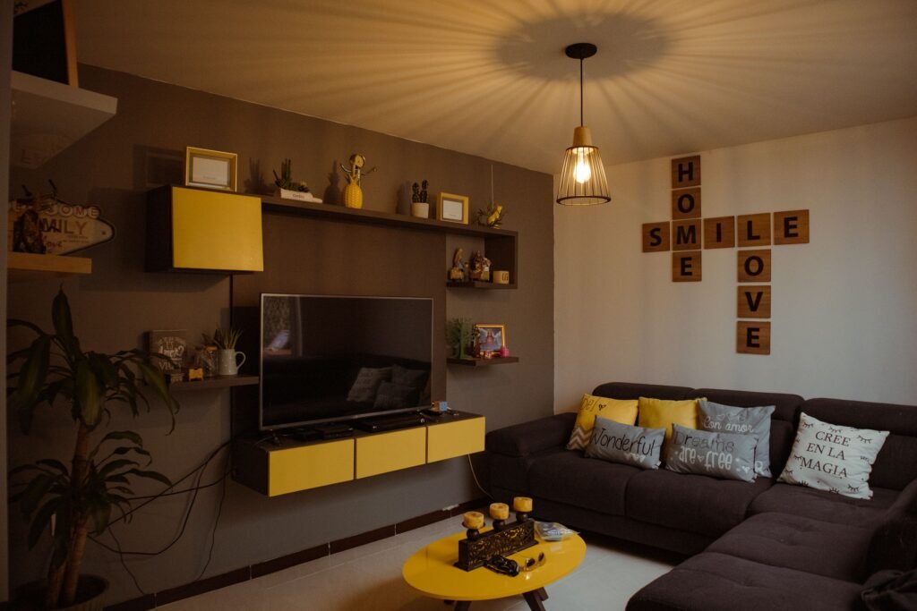living room with sofa TV and decorative shelf