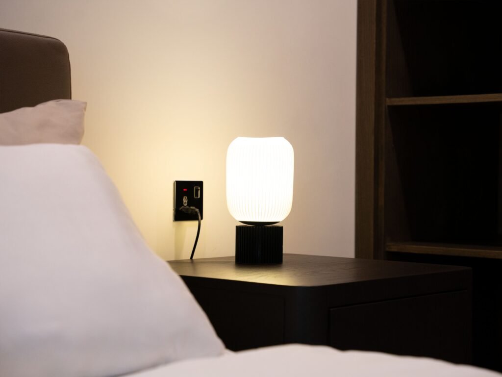 Bedroom with a bedside table and a night lamp