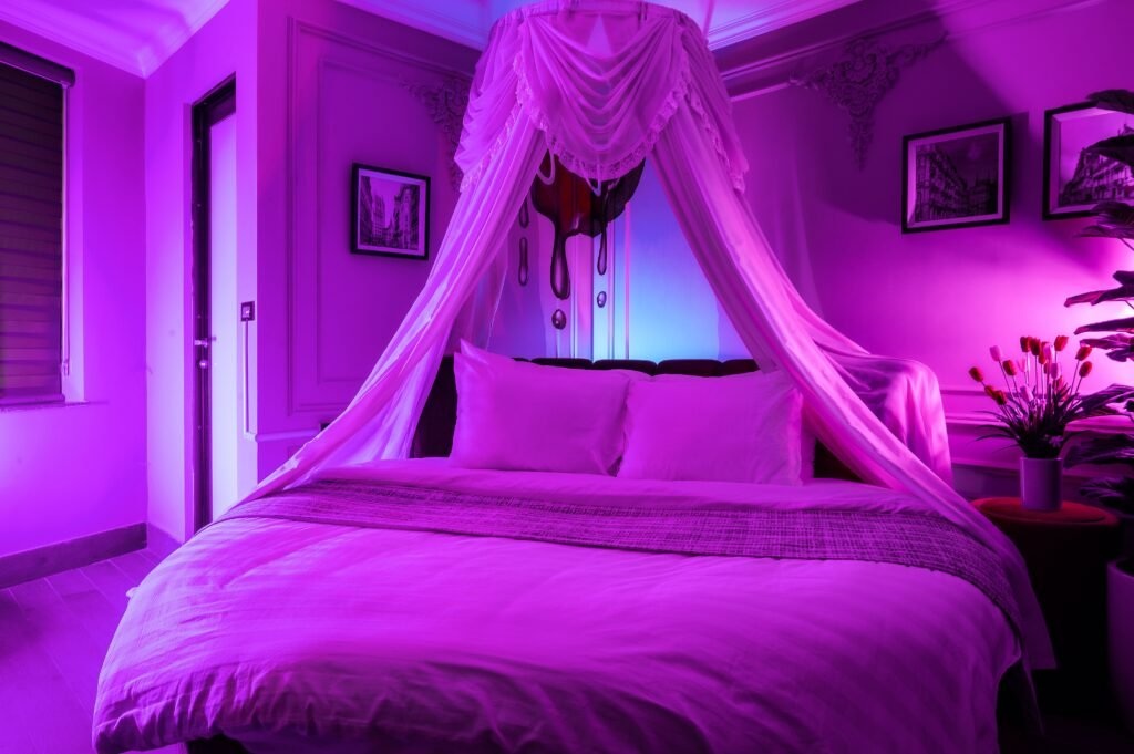 Modern bedroom with pink and blue RGB lighting