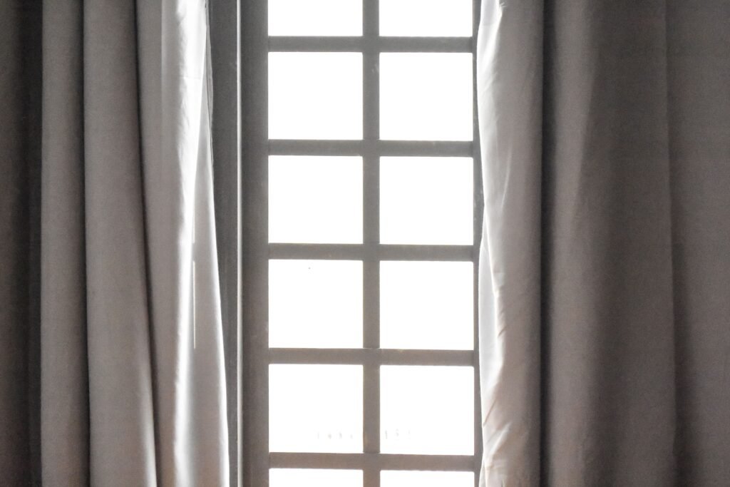 Bedroom window with curtains on both sides